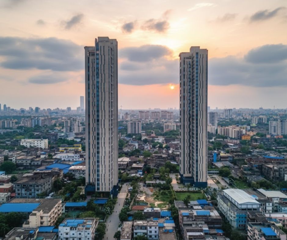The grand exterior view of the modern, high-rise architectural design of PS Aurus Kolkata, a landmark luxury apartment complex situated strategically on EM Bypass Kolkata.