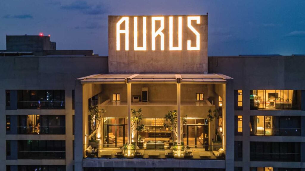 The beautifully landscaped rooftop terrace and exclusive lounge area at PS Aurus Kolkata, offering a tranquil space for residents of the premium residences.